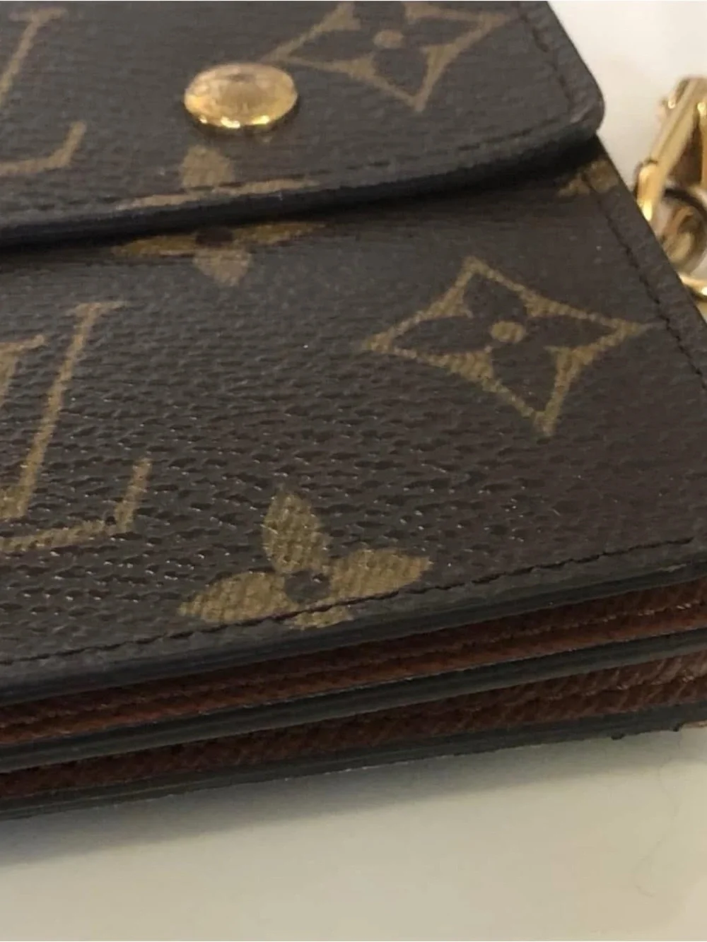 Louis Vuitton Monogram Canvas Accordion Clutch in Brown with Gold Accents